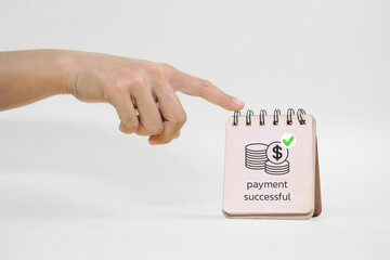 A hand points to a small notepad showing an icon of coins and a checkmark with the text payment...