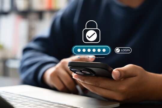 Cyber security, Businessman using smartphone with password login interface,secure access, Identity verification. Concept of protecting sensitive data and ensuring online privacy through authentication