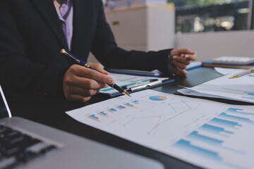 Team of business people working together in the meeting room office,
teamwork background charts and graphs banner, double exposure successful teamwork,business planning concept.