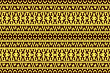 Seamless tribal geometric pattern in yellow and brown with repeating traditional ethnic design.