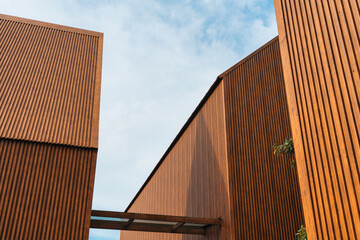 Modern architecture with vertical coated wood metal steel and geometric design