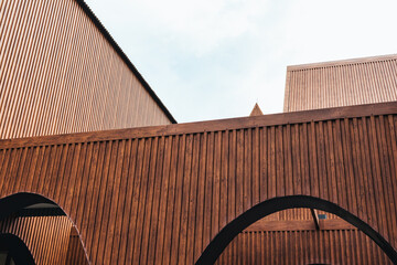 Modern architecture with vertical coated wood metal steel and geometric design