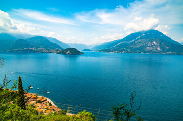 Panorama on Lake Como, with the villages of Tremezzina, Bellagio, Varenna and the mountains that overlook them, photographed in the evening.
