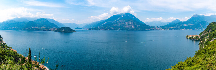 Panorama on Lake Como, with the villages of Tremezzina, Bellagio, Varenna and the mountains that overlook them, photographed in the evening.
