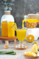 Tropical Pineapple Orange Aloe Vera Juice Poured into Glass. Healthy and natural beverage concept