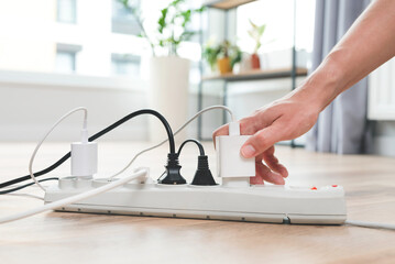 Power strip socket with connected plugs.