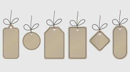 Blank paper price tags or gift tags in different shapes. Set of labels with cord.
