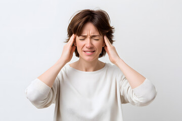 Stressed woman holding head in pain, mental overload and anxiety. Conceptual image of stress, confusion, and overthinking.