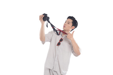 Capture the Moment: A stylish individual engages with their camera, holding it up while looking at...