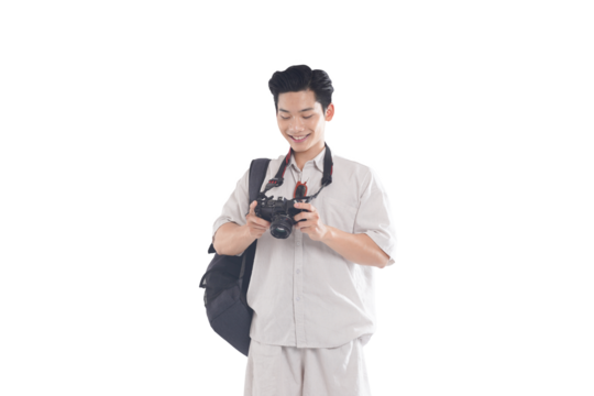 Enthusiastic Photographer with Camera: A young photographer, beaming with excitement, holds a digital camera in hand, examining the images. He's ready to capture more moments.