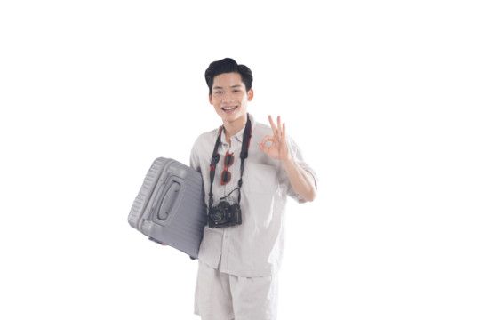 Ready to Travel: A young traveler, fully prepared for adventure, smiles confidently while holding a suitcase and gesturing an "OK" sign. Embracing the excitement of exploration and the ease of travel. - Powered by Adobe