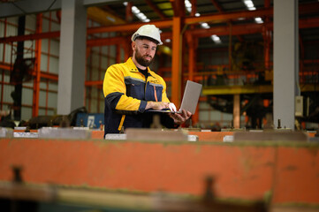 Technician maintains and inspects metal sheets in a metal cheese plant with computers and radio...