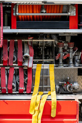 Fire truck equipment showcases hoses and fittings ready for emergency response