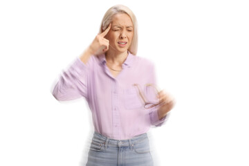 Young woman holding glasses and feeling lightheaded