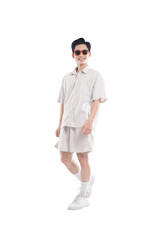 Asian guy wearing tourist clothes and sunglasses posing, travel concept