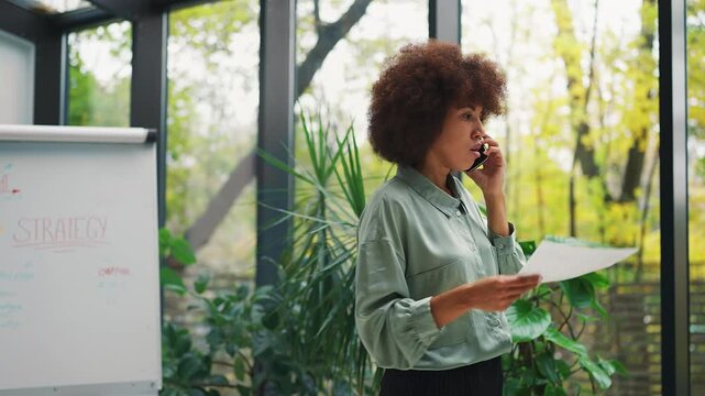 Annoyed African American boss complaining on phone after failed contract deal