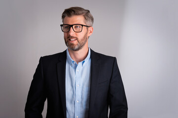 Studio shot of a middle aged man standing against isolated background