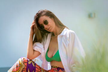 Attractive brunette haired woman relaxing outdoor