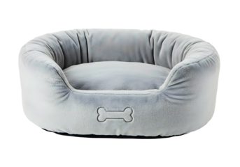 Plush grey oval dog bed with bone detail isolated on transparent background