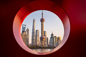 Morning sun rise of Shanghai city modern skyscraper cityscape in blue sky autumn season behind...