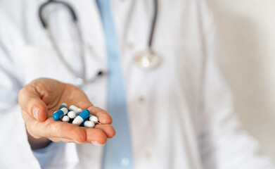Healthcare professional taking notes in a clinical setting during a routine check-up