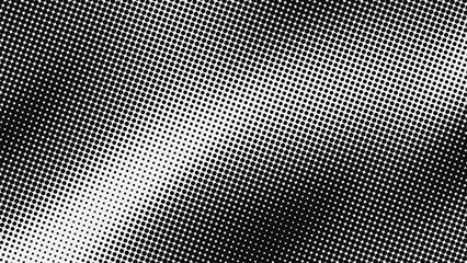 Abstract black and white halftone texture with dots pattern. The gradient from dense to sparse creates a dynamic visual effect.