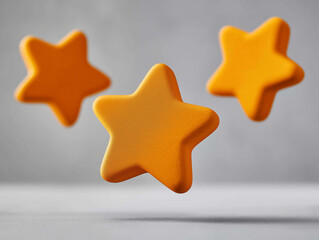 Shining Stars: Three luminous gold stars levitate against a softly blurred backdrop, emanating a sense of wonder and enchantment, perfect for conveying success, quality, and aspiration.
