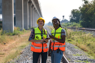 Diversity female locomotive engineers working outdoor at train track