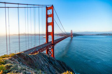Golden Gate Bridge at sunrise in San Francisco, California. Scenic view from Battery Spencer with...