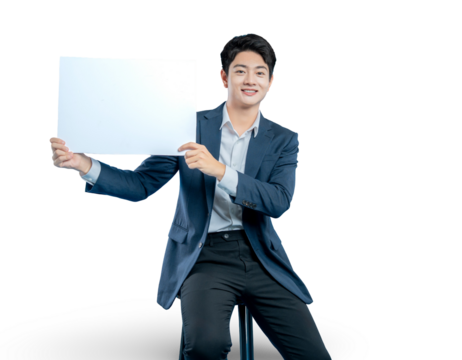 young Asian professional presents a blank white sign with both hands, perfect for displaying a message, logo, or promotion.