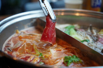 Hot Pot with Thinly Sliced Meat and Fresh Vegetables – Close-Up of Cooking Moment