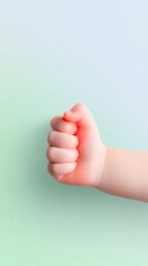 Tiny Baby Hand Gripping Adult Finger Soft Pastel Green Background