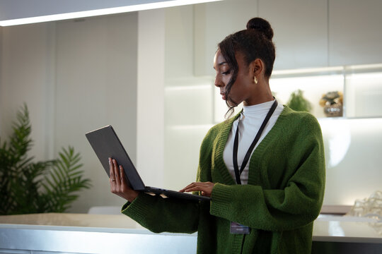 Diverse Office Portrait of Black Businesswoman in office and thinking while working on laptop, Business marketing, social media update or networking, black woman, African female worker - Powered by Adobe