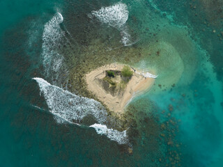 Aerial view of a beautiful small tropical island. Aerial view of a small island with turquoise water