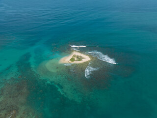 Aerial view of a beautiful small tropical island. Aerial view of a small island with turquoise water