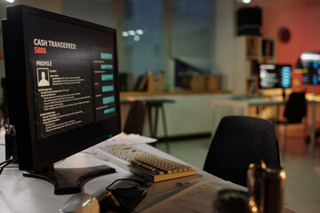 Close up view of computer monitor displaying amount of cash transferred and personal information in...