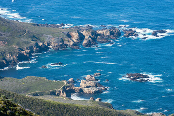 Aerial view of rugged coastline and ocean cliffs along Highway 1 near Soberanes Canyon in Garrapata...