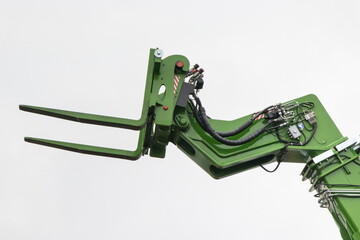 Forklift loader or stacker. Part of hydraulic and pneumatic mechanism in machine. Technology in...