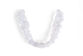 Invisible braces lying on a transparent background representing modern dental healthcare