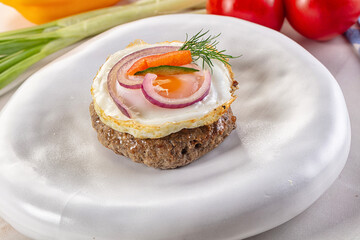Beefsteak chop with roasted egg
