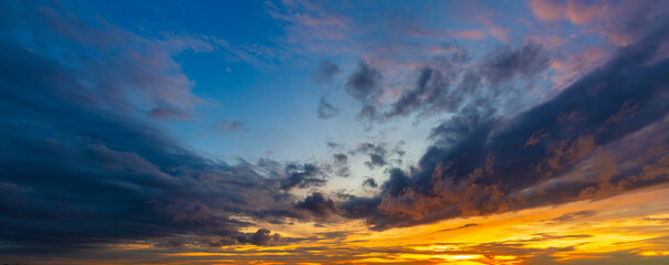 Rain clouds and evening sky,Amazing sunset skyscape. Evening sky with bright colorful orange and...