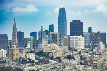 Panoramic view of downtown San Francisco skyline, featuring iconic skyscrapers and urban architecture, seen from across the bay near Highway 1 in Northern California