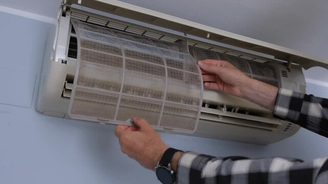 Air conditioner filter dusty. Preparation for maintenance and cleaning