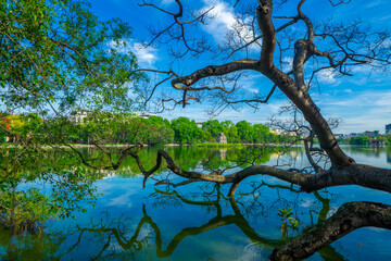 View of Turtle Tower at Hoan Kiem Lake in spring with beautiful reflection, an important historical building in Hanoi, Vietnam