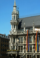 Corner gothic tower of the New City Hall of Munich in Marienplatz decorated the the LGBT flags