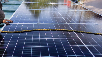 Installing solar panels on a rooftop for renewable energy