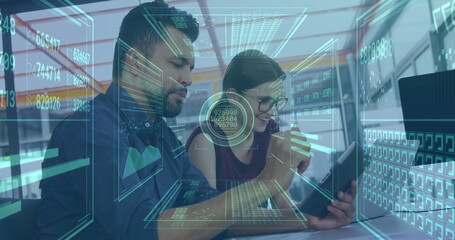 Two analysts wearing glasses examining tablet screen in modern office, with holographic data charts