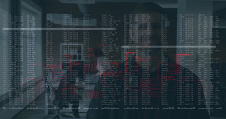 Collaborating colleagues analyzing code and data overlays in meeting room, with laptops and mugs