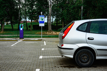 Power supply for charging of electric car on parking lot. Electric car charging station.