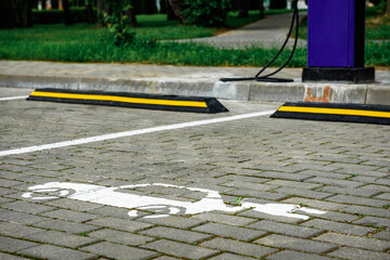 Power supply for charging of electric car on parking lot. Electric car charging station.